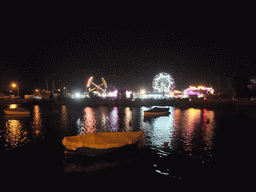 Boats in Marsamxett Harbour and Manoel Island with funfair attractions, by night