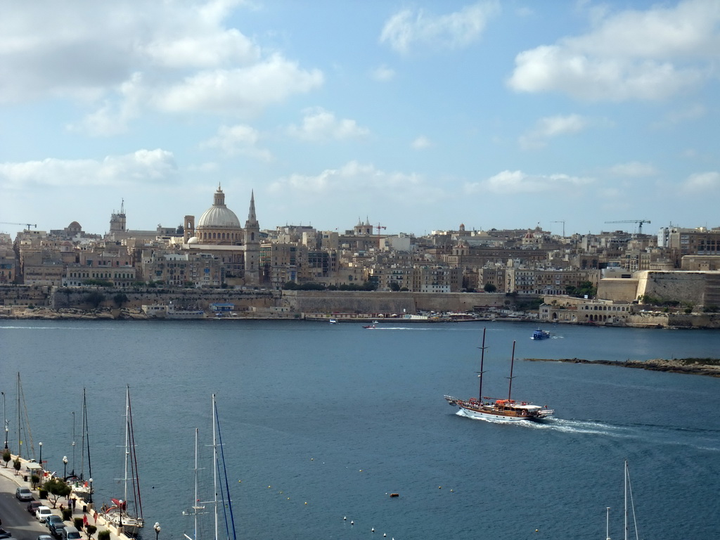 Boats in Marsamxett Harbour and Valletta with the dome of the Carmelite Church and the tower of St Paul`s Pro-Cathedral, viewed from the roof terrace of the Marina Hotel