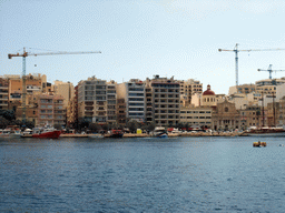 The Tigné Seafront with the front of the Marina Hotel and the Parish Church of Jesus of Nazareth, viewed from the Luzzu Cruises tour boat from Sliema to Marsaxlokk