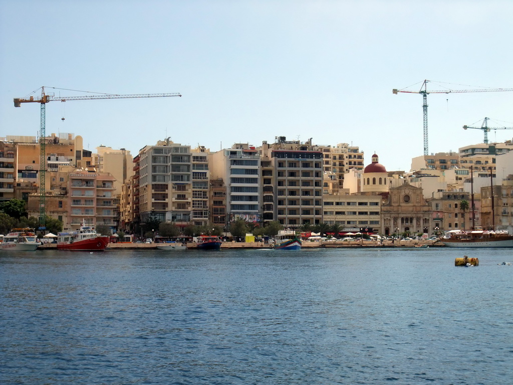 The Tigné Seafront with the front of the Marina Hotel and the Parish Church of Jesus of Nazareth, viewed from the Luzzu Cruises tour boat from Sliema to Marsaxlokk