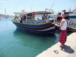 Miaomiao with our Luzzu Cruises tour boat, at the harbour of Marsaxlokk