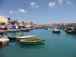 Fish market and fishing boats at the harbour of Marsaxlokk