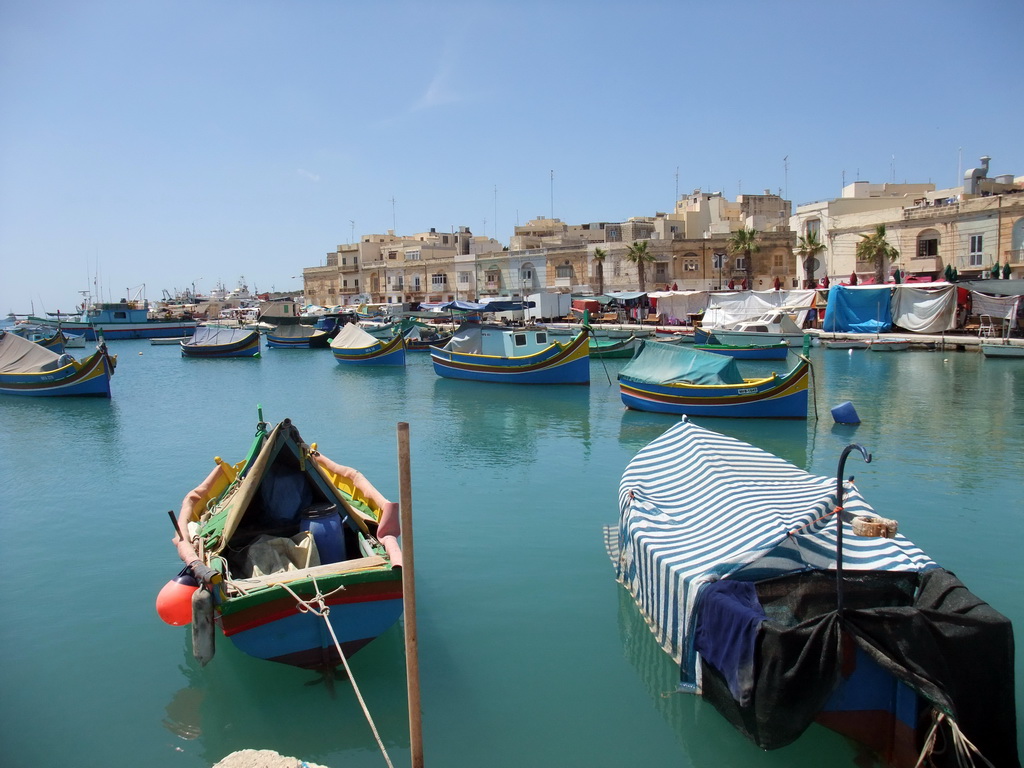 Fish market and fishing boats at the harbour of Marsaxlokk