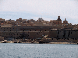 The Grand Harbour and Valletta with the towers and dome of St. John`s Co-Cathedral, viewed from the Luzzu Cruises tour boat from Marsaxlokk to Sliema