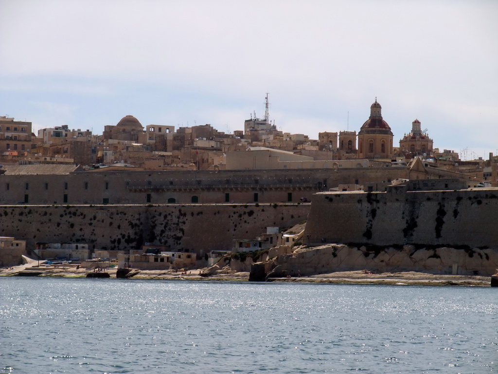 The Grand Harbour and Valletta with the towers and dome of St. John`s Co-Cathedral, viewed from the Luzzu Cruises tour boat from Marsaxlokk to Sliema