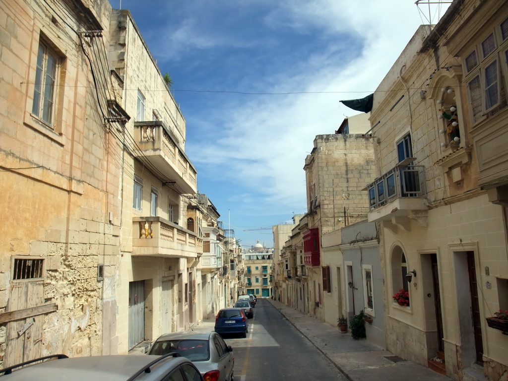 San Publiju street in Sliema with a view on Valletta with the dome of the Carmelite Church and the tower of St Paul`s Pro-Cathedral