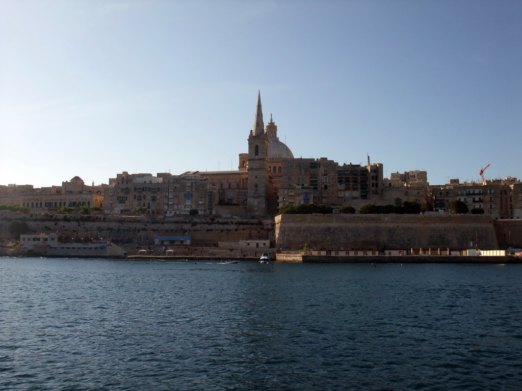 Valletta with the dome of the Carmelite Church and the tower of St Paul`s Pro-Cathedral, viewed from the ferry from Sliema to Valletta