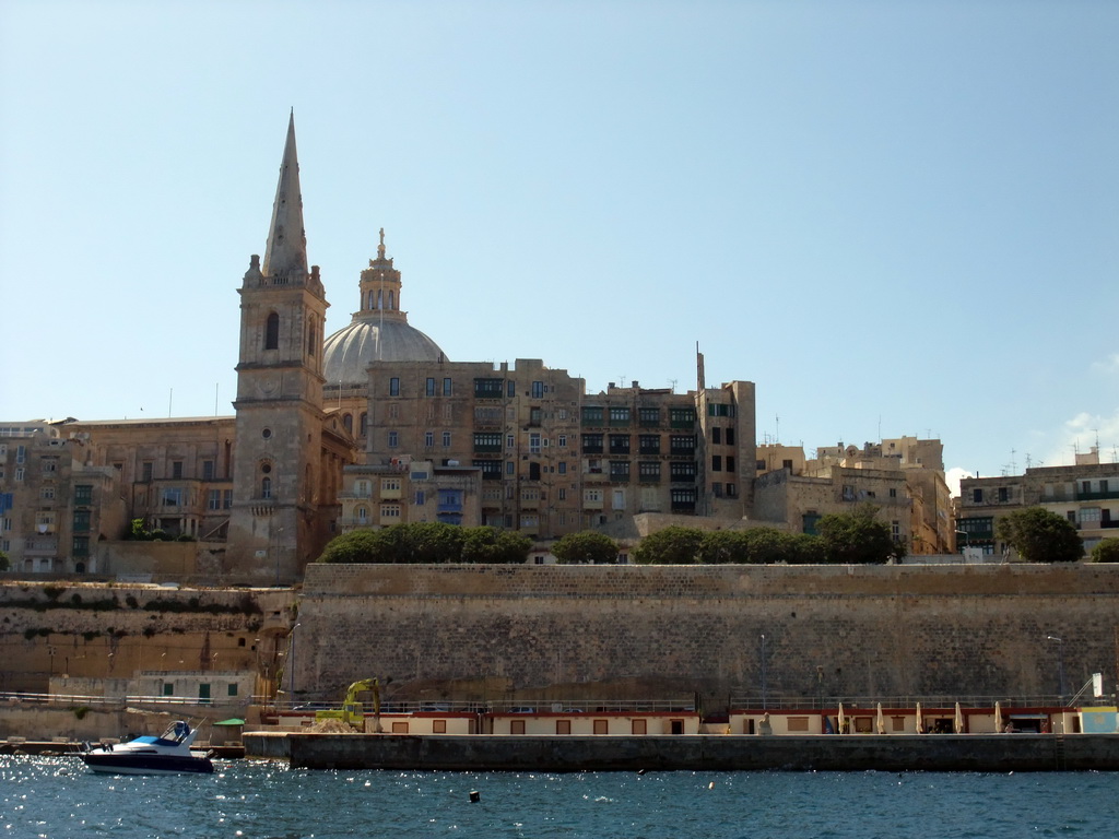 The Valletta United Waterpolo Pitch, and Valletta with the dome of the Carmelite Church and the tower of St Paul`s Pro-Cathedral, viewed from the ferry from Sliema to Valletta