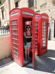 Miaomiao in telephone booth at the Great Siege Square at Valletta