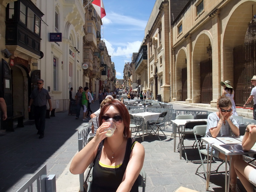 Miaomiao having drinks on a terrace at Triq Il-Merkanti street at Valletta