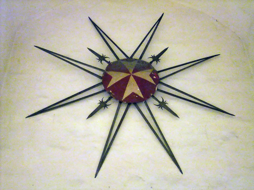 Maltese cross on the wall of the Armoury of the Grandmaster`s Palace at Valletta