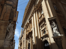 Statues on the corners of houses near the Grandmaster`s Palace at Valletta