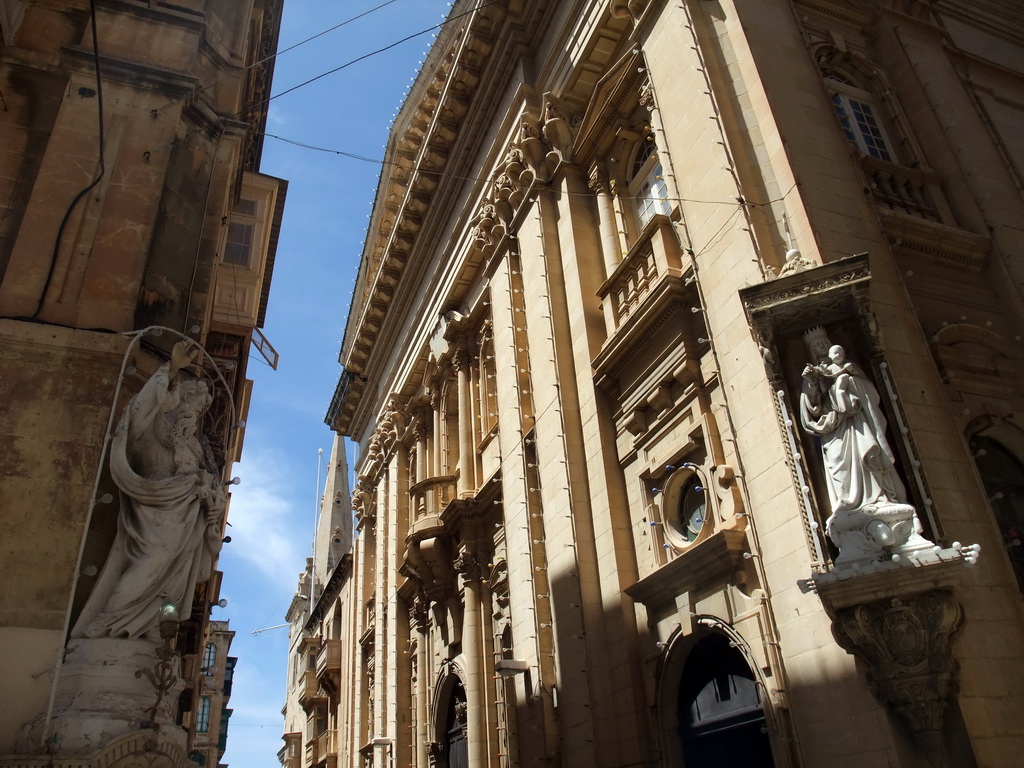 Statues on the corners of houses near the Grandmaster`s Palace at Valletta