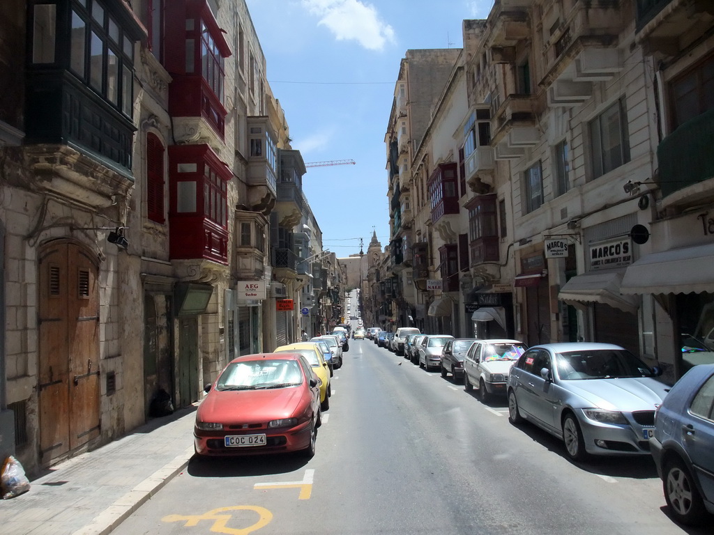The Triq I-Ifran street with the Parish Church of St. Augustine and the St. John`s Cavalier building at Valletta
