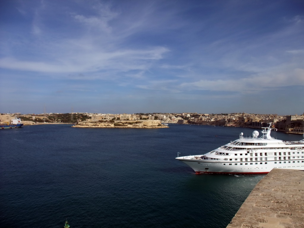 Yacht in the Grand Harbour, Villa Bighi at the town of Kalkara, Fort St. Angelo and the town of Birgu viewed from the Siege Bell Monument at Valletta