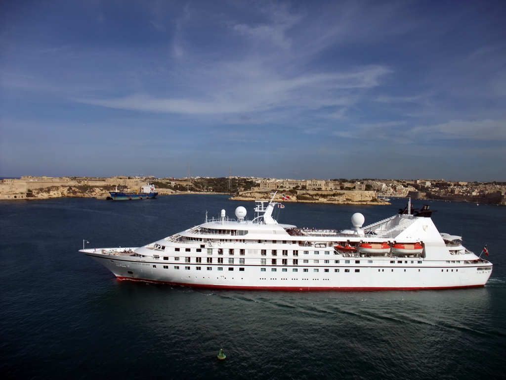 Yacht in the Grand Harbour, Fort Ricasoli and Villa Bighi at the town of Kalkara, viewed from the Siege Bell Monument at Valletta