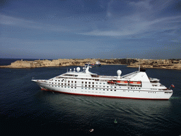 Yacht in the Grand Harbour, Fort Ricasoli and Villa Bighi at the town of Kalkara, viewed from the Siege Bell Monument at Valletta