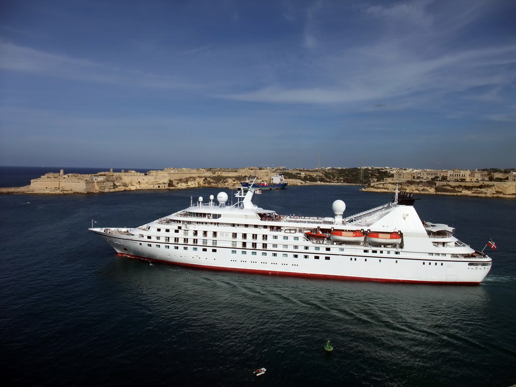 Yacht in the Grand Harbour, Fort Ricasoli and Villa Bighi at the town of Kalkara, viewed from the Siege Bell Monument at Valletta