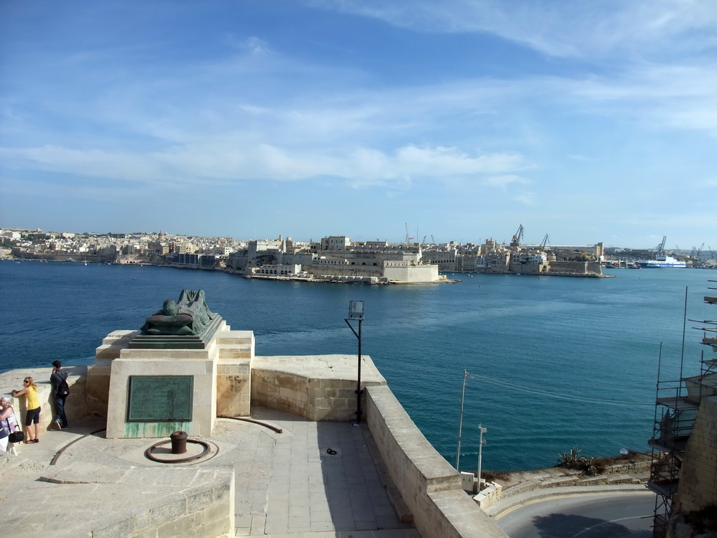 The Grand Harbour, Fort St. Angelo, the town of Birgu and the World War II Memorial at the Siege Bell Monument at Valletta