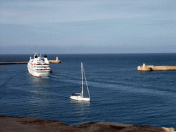 Boats in the Grand Harbour with the pier at Fort Saint Elmo and the pier at Fort Ricasoli, viewed from the Siege Bell Monument at Valletta