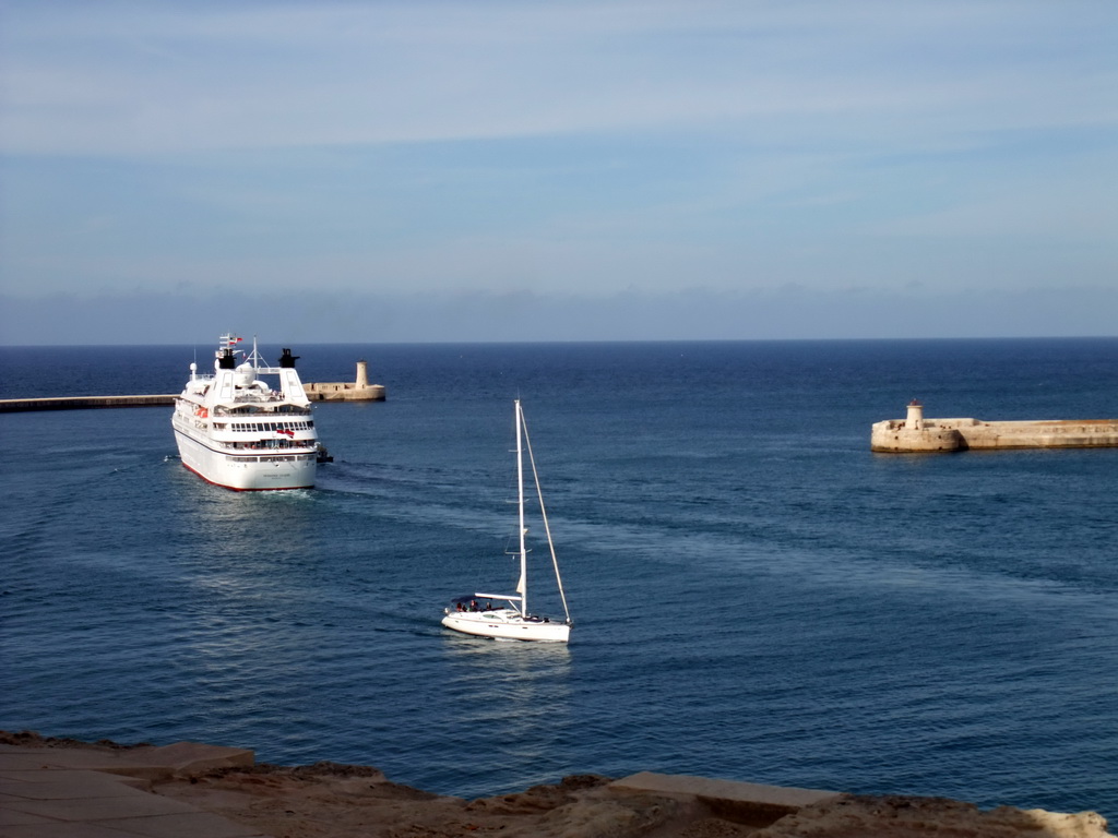 Boats in the Grand Harbour with the pier at Fort Saint Elmo and the pier at Fort Ricasoli, viewed from the Siege Bell Monument at Valletta