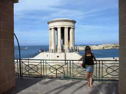 Miaomiao at the Lower Barracca Gardens at Valletta, with a view on the Siege Bell Monument and the Grand Harbour with the pier at Fort Saint Elmo and Fort Ricasoli