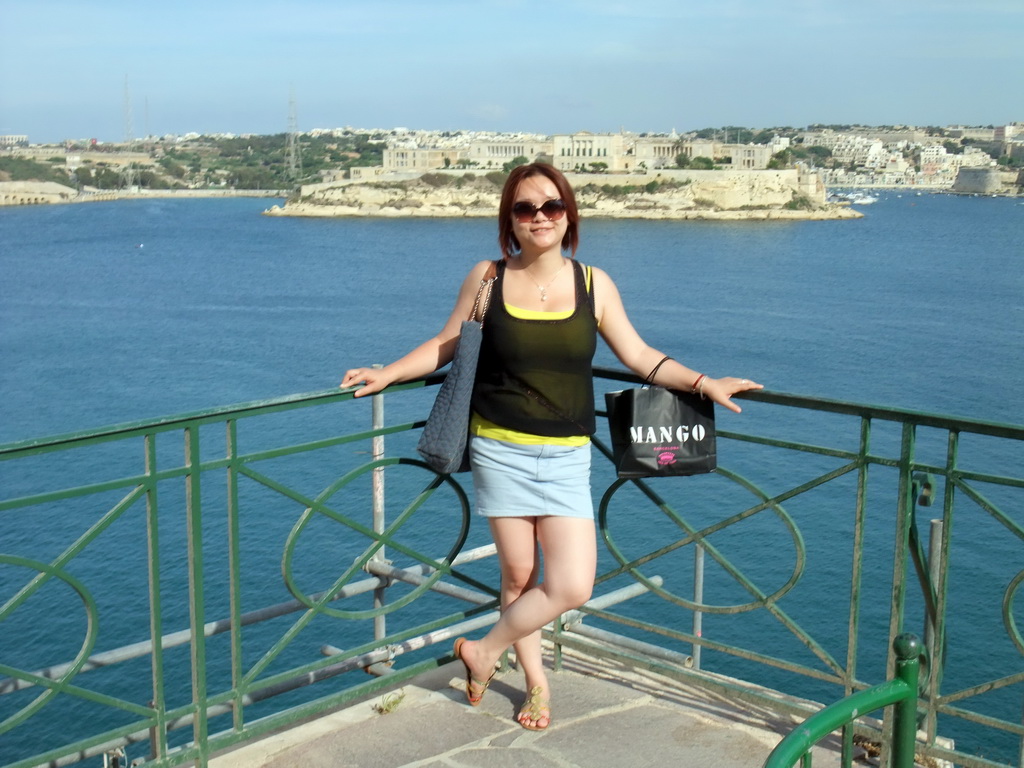 Miaomiao at the Lower Barracca Gardens at Valletta, with a view on the Grand Harbour and Villa Bighi at the town of Kalkara