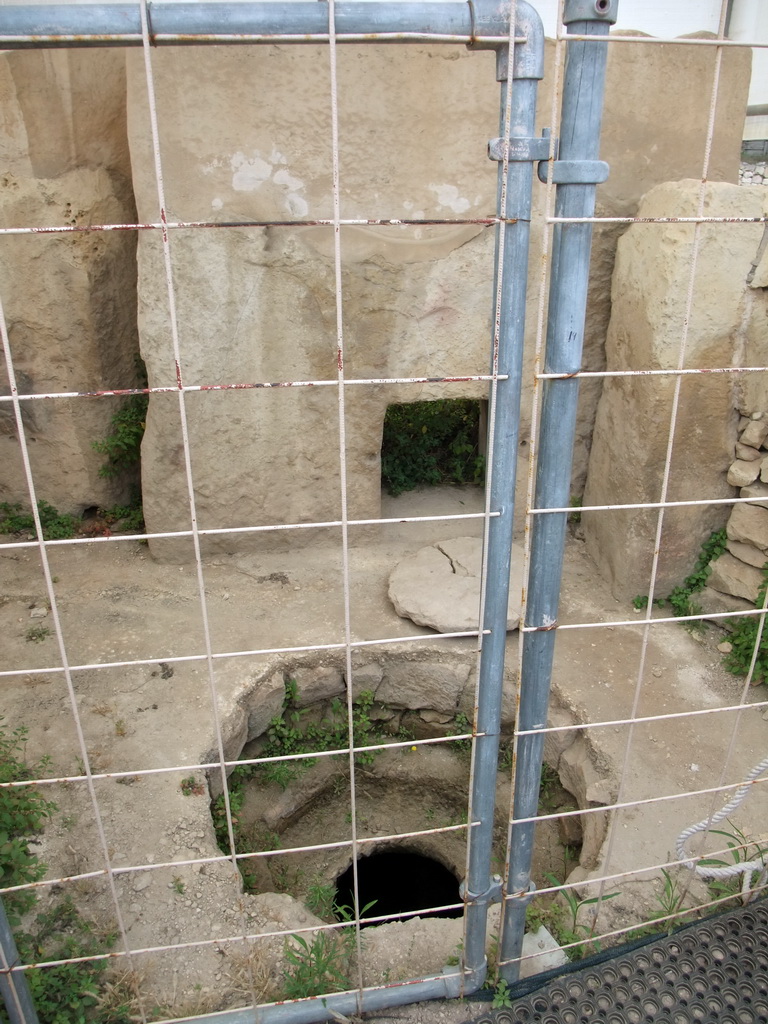 Hole in the ground at the Chamber of Animal Reliefs at the Tarxien Temples at Tarxien