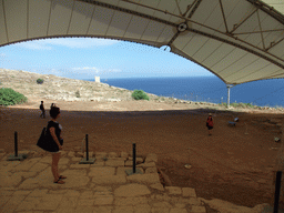 Miaomiao at the east side of the Mnajdra Temples, with a view on the Hamrija Tower and the Mediterranean Sea