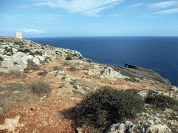 The Hamrija Tower, a natural arch and the Mediterranean Sea