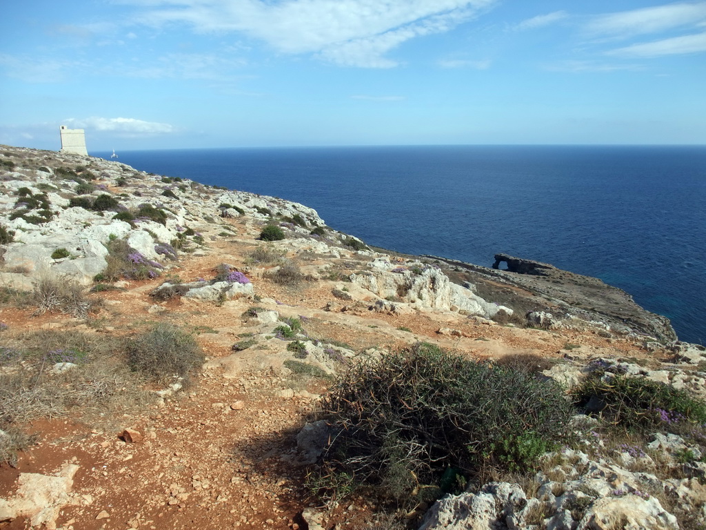 The Hamrija Tower, a natural arch and the Mediterranean Sea