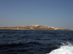 The north coast of Malta with St. Mark`s Tower and the Maghtab waste disposal site, viewed from the Luzzu Cruises tour boat from Malta to Gozo
