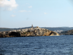 St Paul`s Island with the statue of St. Paul, viewed from the Luzzu Cruises tour boat from Comino to Malta