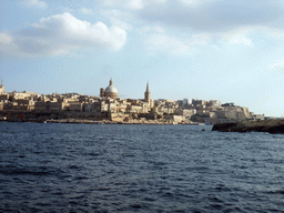 Valletta with the dome of the Carmelite Church and the tower of St Paul`s Pro-Cathedral, viewed from the Luzzu Cruises tour boat from Comino to Malta