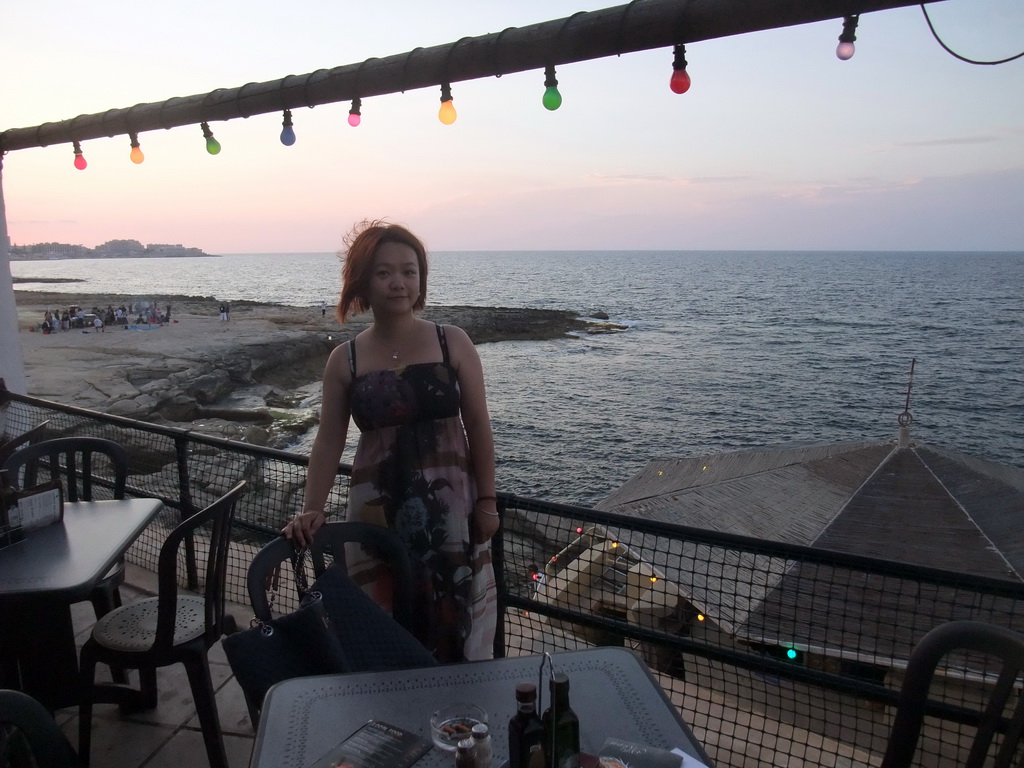 Miaomiao at the terrace of the restaurant `Il-Fortizza` at the Triq It-Torri street at Sliema, at sunset