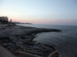 The beach of Sliema with a film crew, viewed from the terrace of the restaurant `Il-Fortizza` at the Triq It-Torri street at Sliema, at sunset