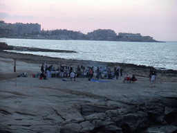 The beach of Sliema with a film crew, viewed from the terrace of the restaurant `Il-Fortizza` at the Triq It-Torri street at Sliema, at sunset