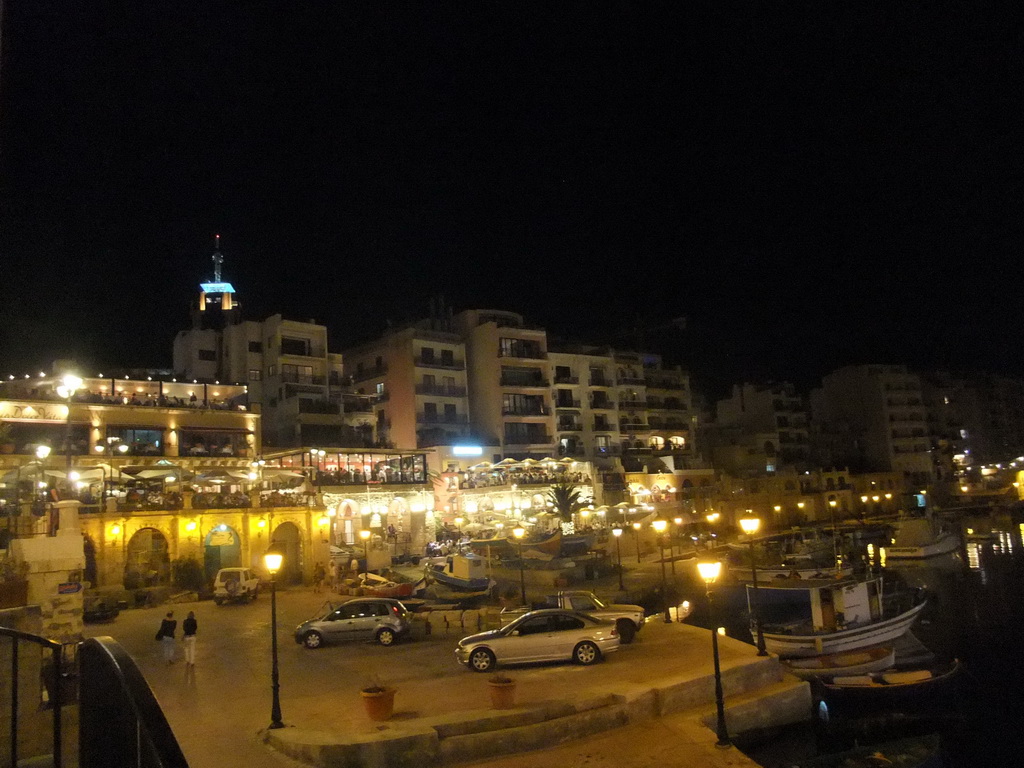 Spinola Bay at St. Julian`s, with restaurants and the Hilton Malta Hotel, by night