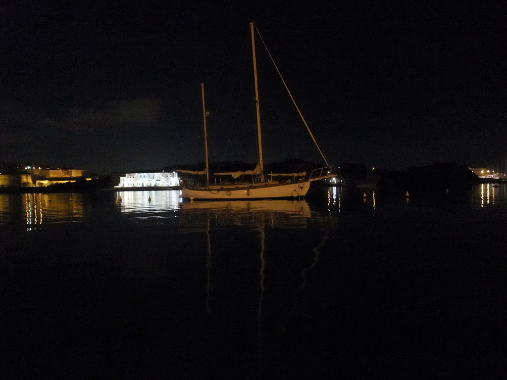 Boat in Marsamxett Harbour and Manoel Island, by night