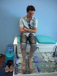 Tim with little fish in the `Bubbles - Dr Fish Foot Spa` at Sliema