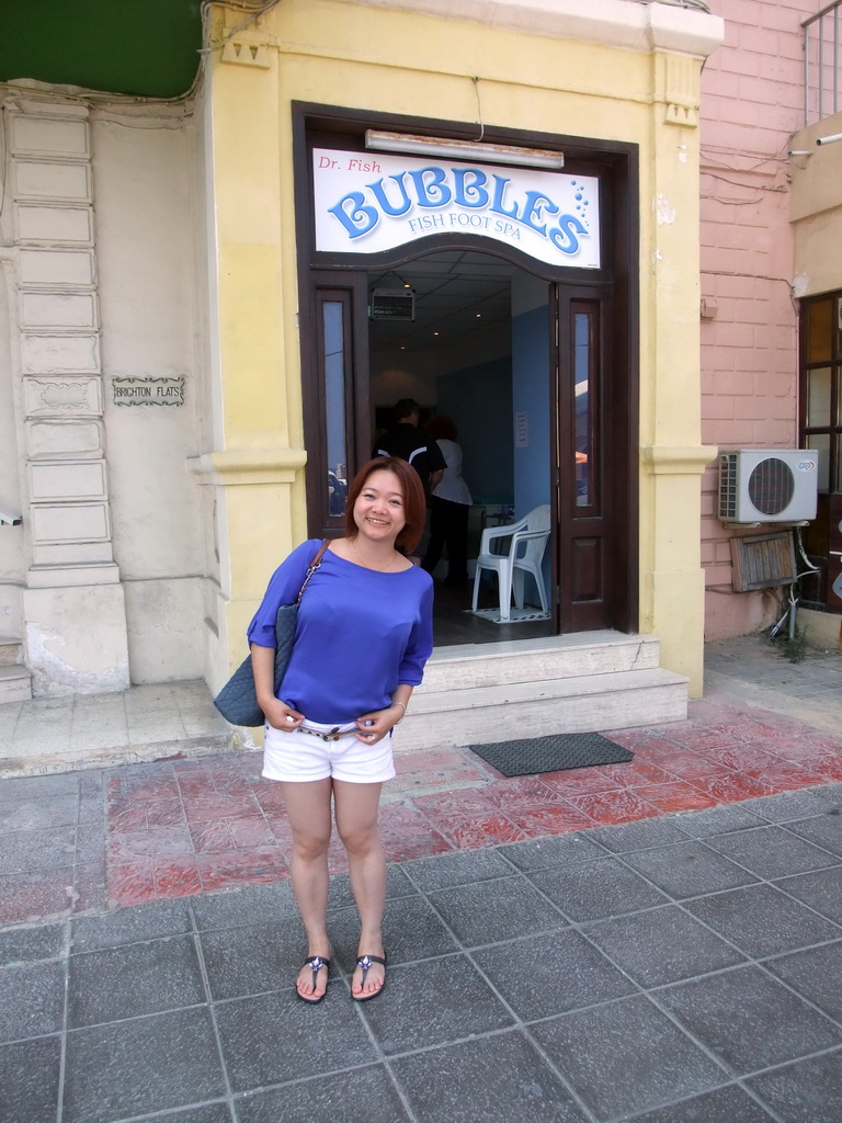 Miaomiao at the front of the `Bubbles - Dr Fish Foot Spa` at the Triq It-Torri street at Sliema