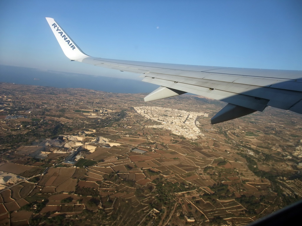 The town of Siggiewi and the south coastline of Malta, viewed from the airplane from Malta to Eindhoven