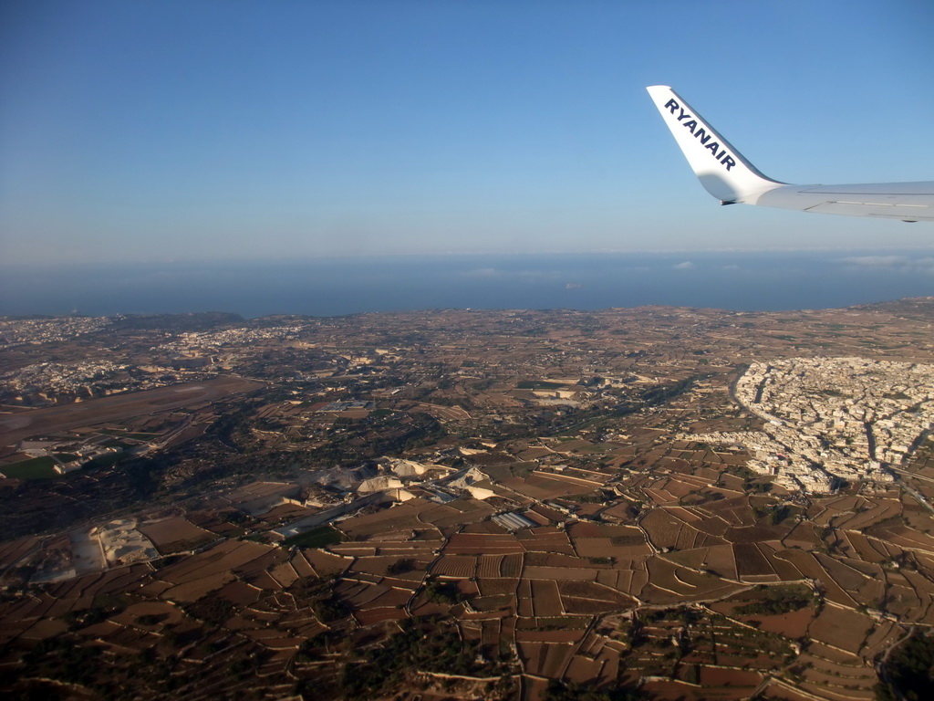 The town of Siggiewi and the south coastline of Malta, viewed from the airplane from Malta to Eindhoven