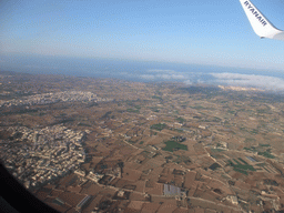 The towns of Zebbug and Siggiewi and the south coastline of Malta, viewed from the airplane from Malta to Eindhoven