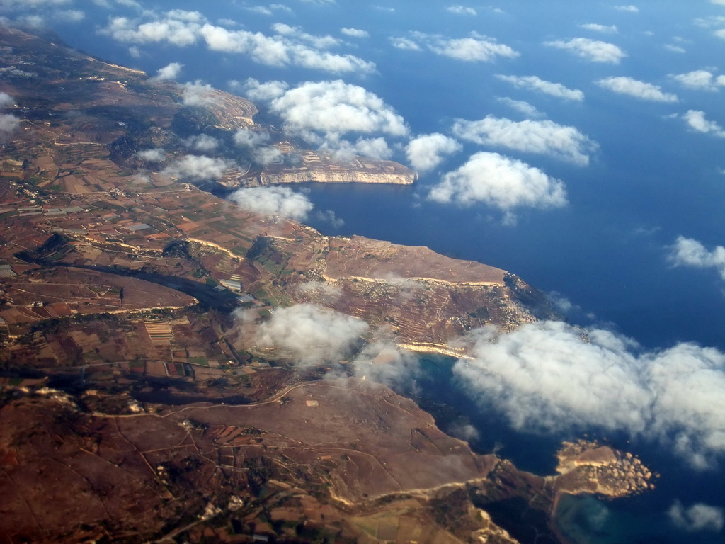 Golden Bay, Ghajn Tuffieha Bay and Gnejna Bay at the west coastline of Malta, viewed from the airplane from Malta to Eindhoven