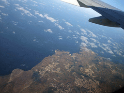 The towns of Munxar, San Lawrenz, Kercem and Xlendi and Dwejra Bay with the Fungus Rock at the west coastline of Gozo, viewed from the airplane from Malta to Eindhoven