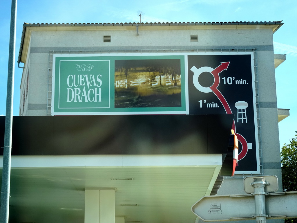 Sign for the Drach Caves at the Ronda del Port street, viewed from the rental car