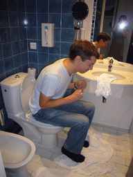 Tim on the toilet of our room in the Best Western Marseille Aéroport Hotel