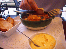 Tim having Bouillabaisse in a restaurant at the Old Port