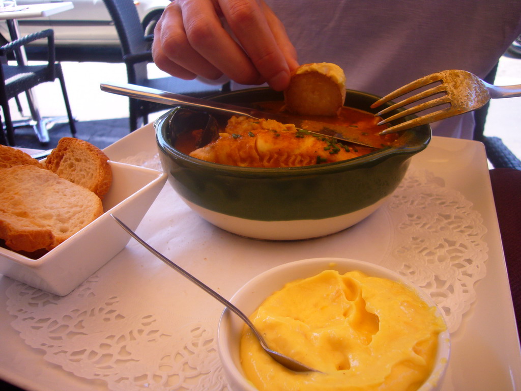 Tim having Bouillabaisse in a restaurant at the Old Port